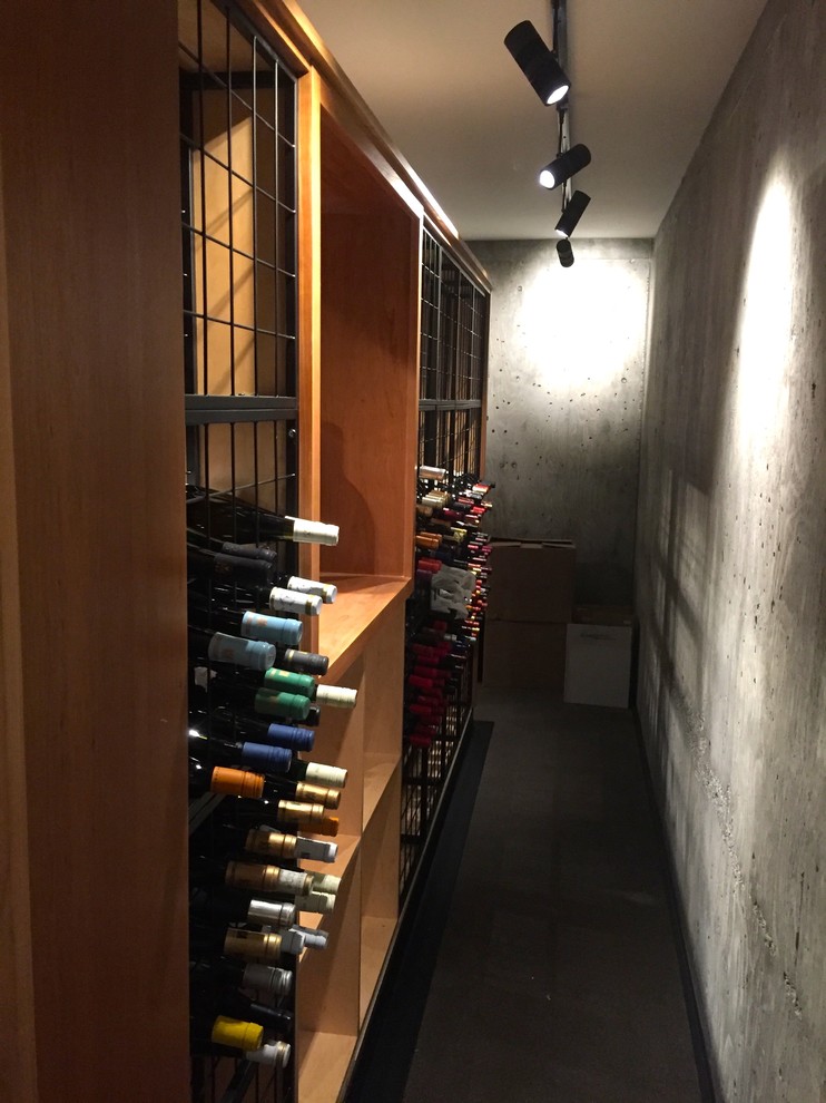 Inspiration for a contemporary wine cellar remodel in Other