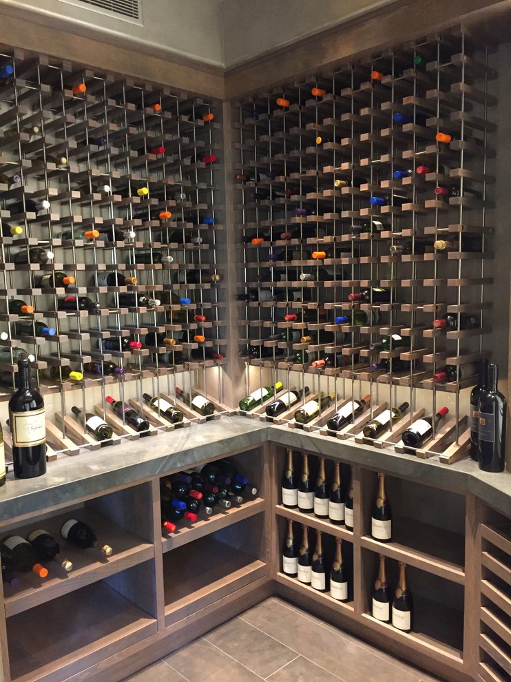 Example of a trendy wine cellar design in San Diego with storage racks