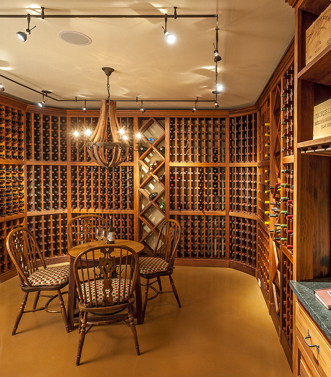 Large classic wine cellar in Albuquerque with display racks.