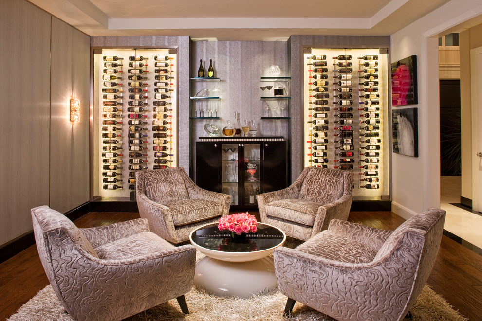 Large trendy dark wood floor and brown floor wine cellar photo in Los Angeles with storage racks
