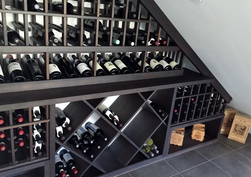 Wine cellar - small traditional wine cellar idea in Los Angeles with display racks