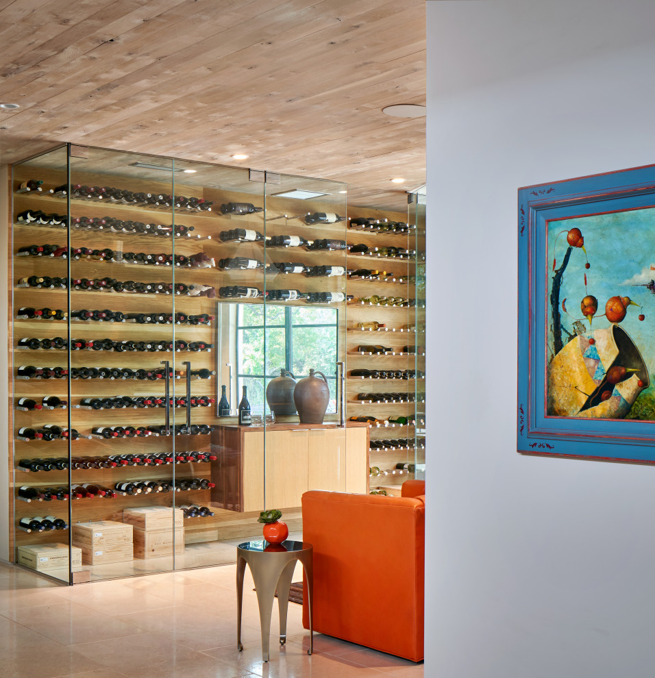 Country wine cellar in Austin with storage racks and beige floors.