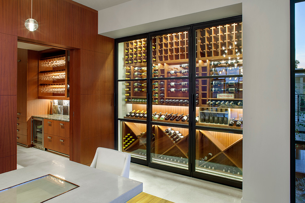 Example of a minimalist wine cellar design in Austin with storage racks