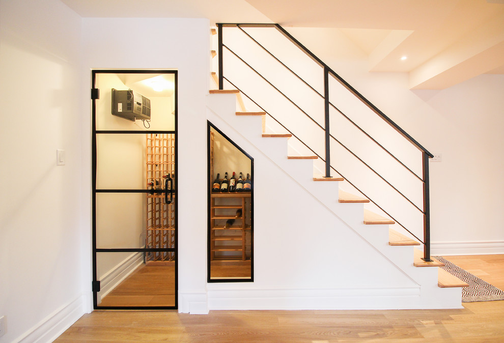 Example of a transitional wine cellar design in Montreal