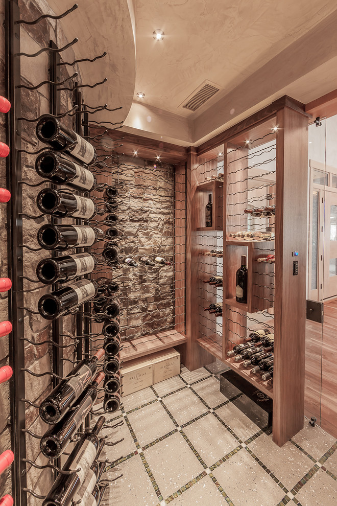 This is an example of a medium sized traditional wine cellar in Denver with storage racks.