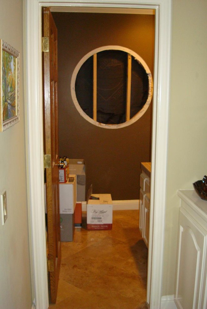 Photo of a small classic wine cellar in Orange County with storage racks.