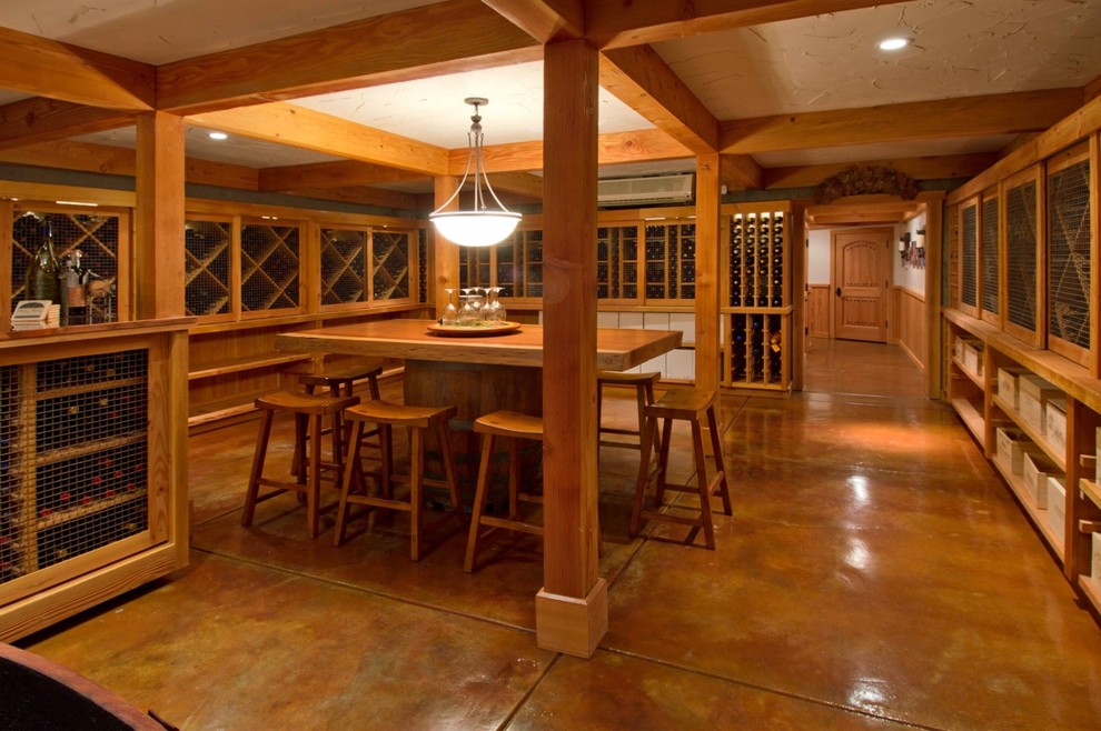This is an example of a traditional wine cellar in San Francisco with brown floors.