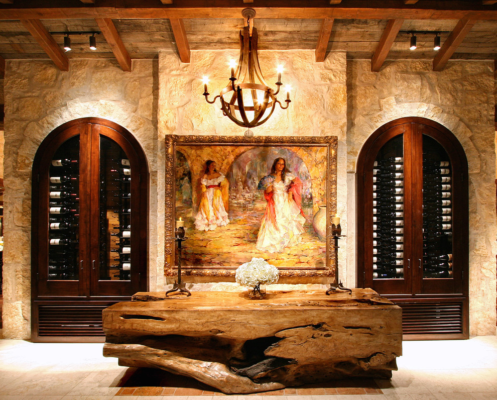 This is an example of a mediterranean wine cellar in Austin with display racks.