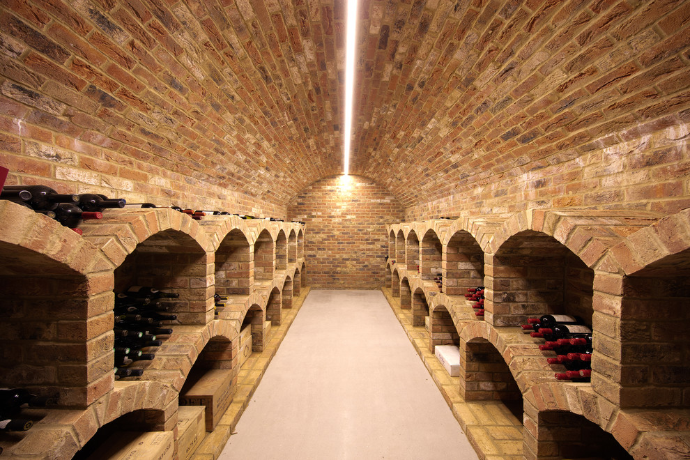Photo of a traditional wine cellar in Hampshire with storage racks.