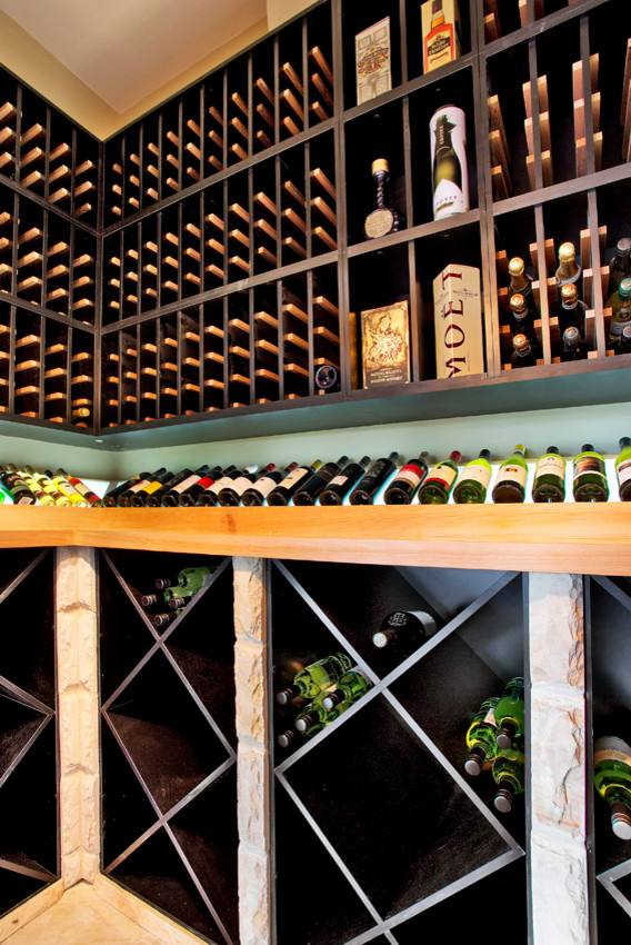 Inspiration for a medium sized farmhouse wine cellar in Sydney with travertine flooring, storage racks and beige floors.