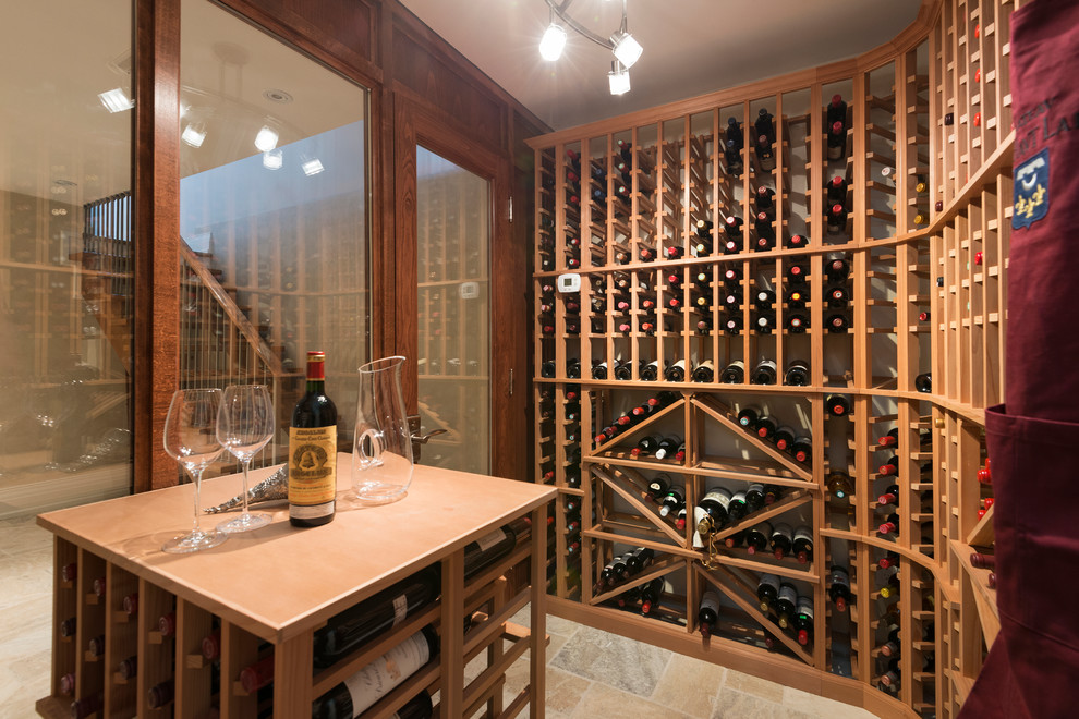 Inspiration for a mid-sized transitional wine cellar remodel in Toronto with storage racks
