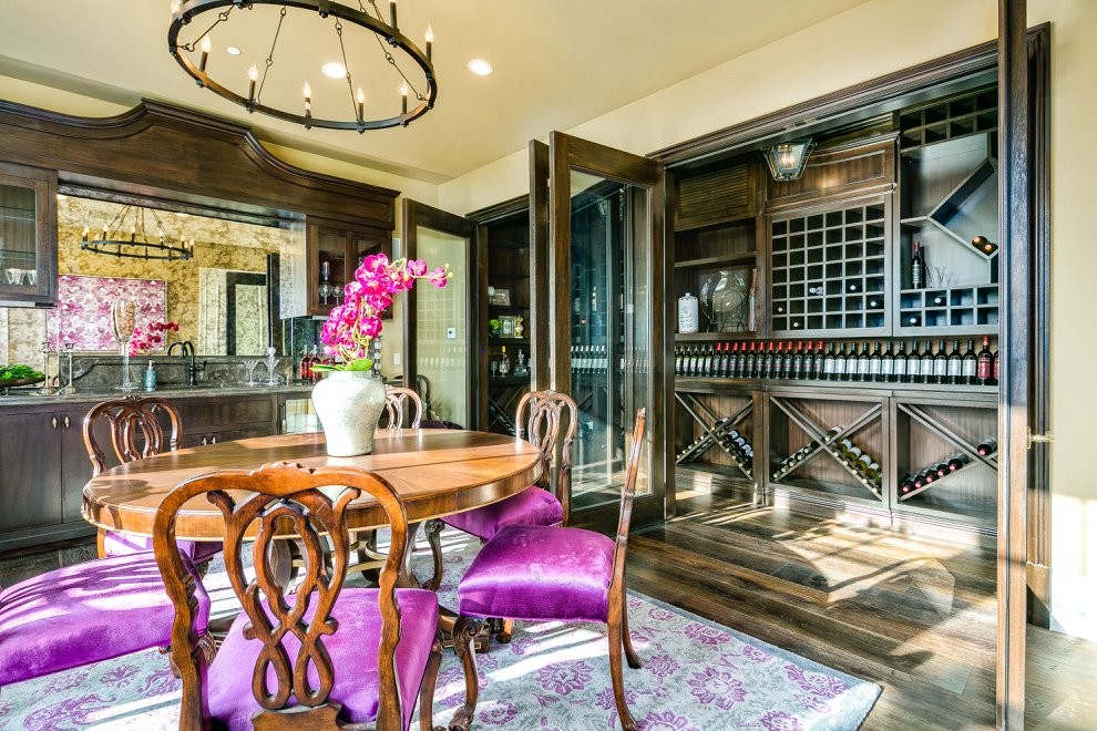 Inspiration for a timeless dark wood floor wine cellar remodel in Los Angeles with diamond bins