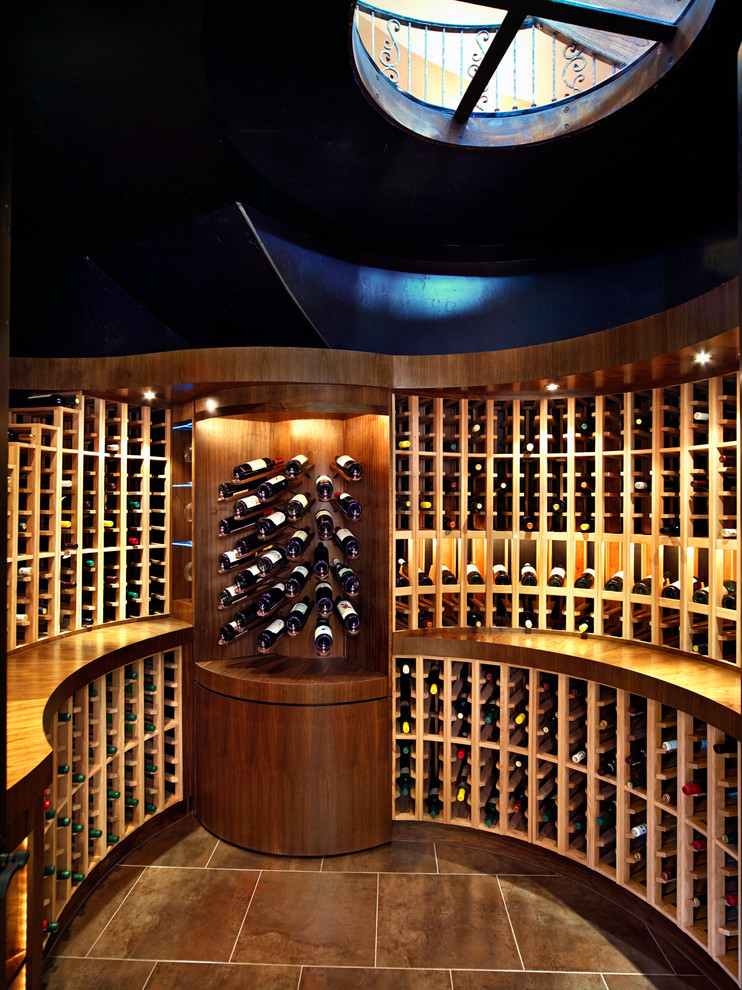 Inspiration for a contemporary wine cellar in Portland with storage racks and brown floors.