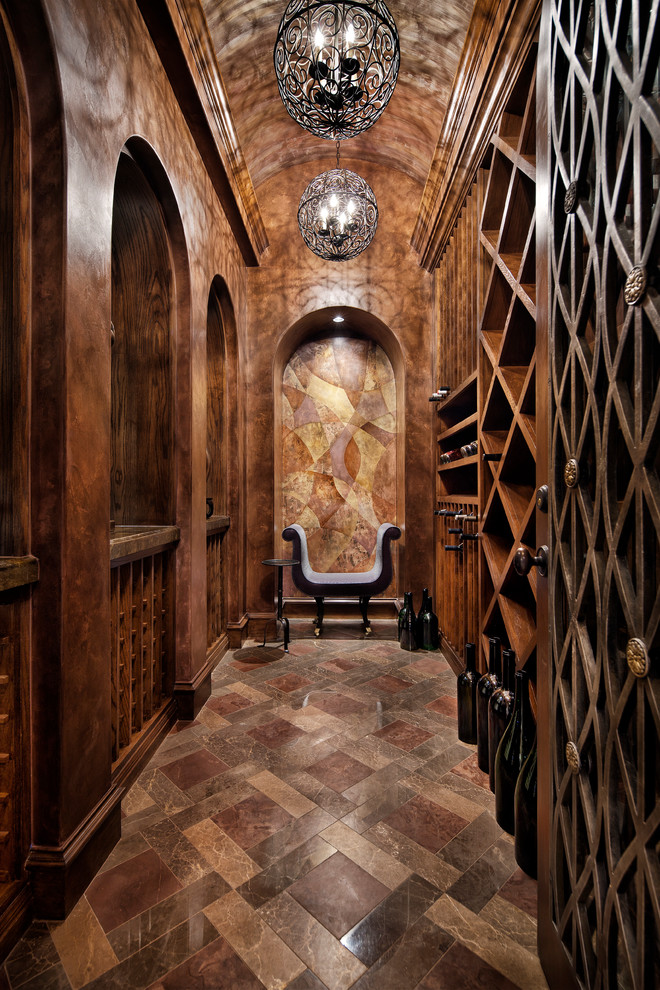Inspiration for a large mediterranean wine cellar in Houston with cube storage.