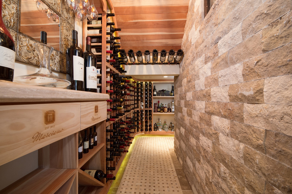 Design ideas for a medium sized mediterranean wine cellar in Phoenix with travertine flooring and storage racks.