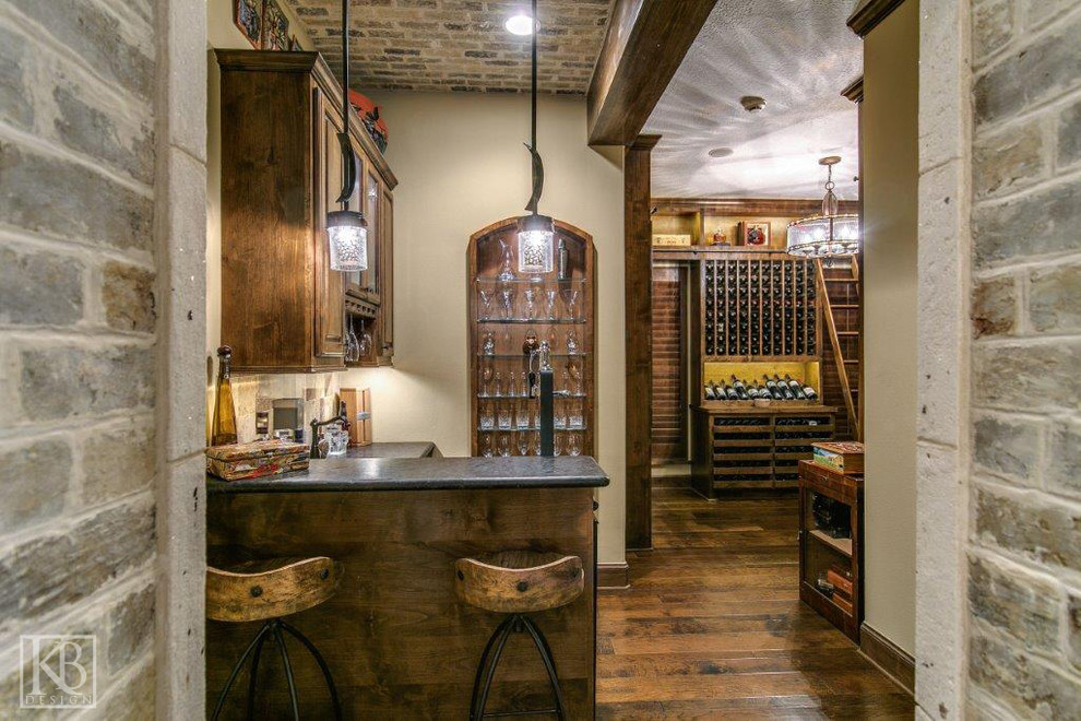Design ideas for a medium sized wine cellar in Houston with dark hardwood flooring and storage racks.
