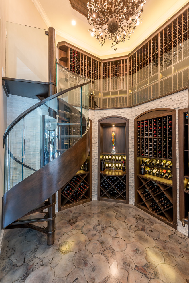 Wine cellar - mid-sized transitional light wood floor and beige floor wine cellar idea in Orlando with storage racks