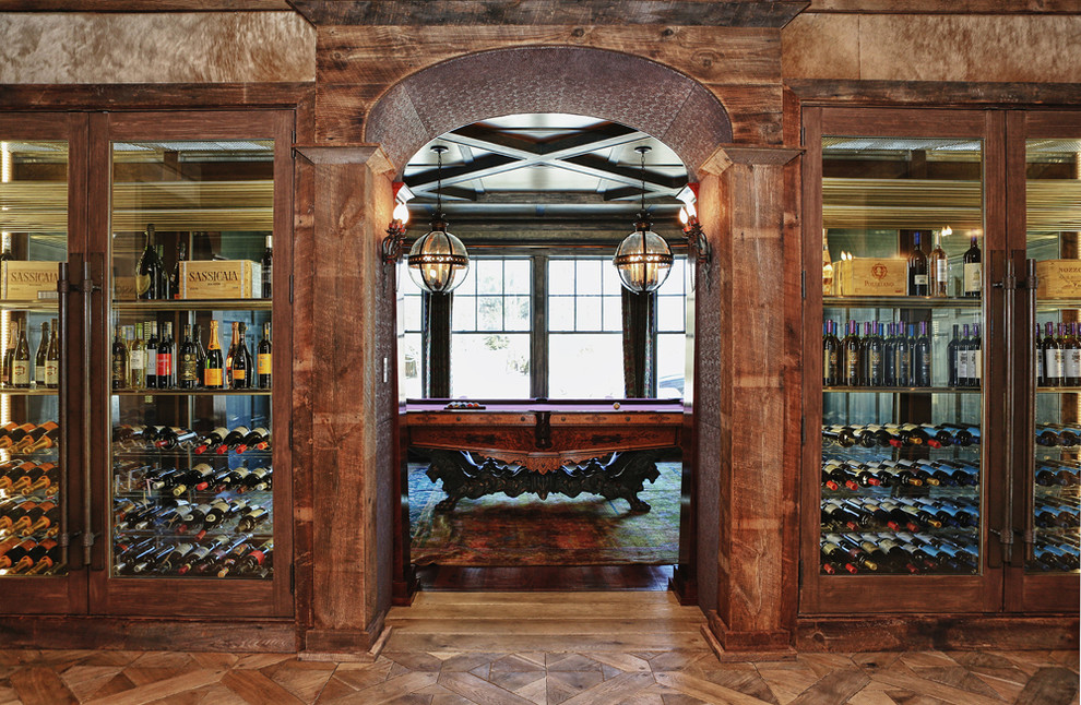 Design ideas for a rustic wine cellar in New York with storage racks.