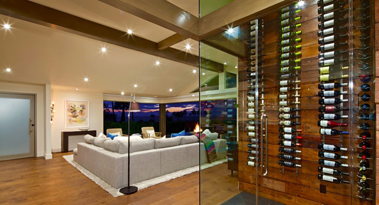 Photo of a large contemporary wine cellar in Los Angeles with slate flooring and display racks.