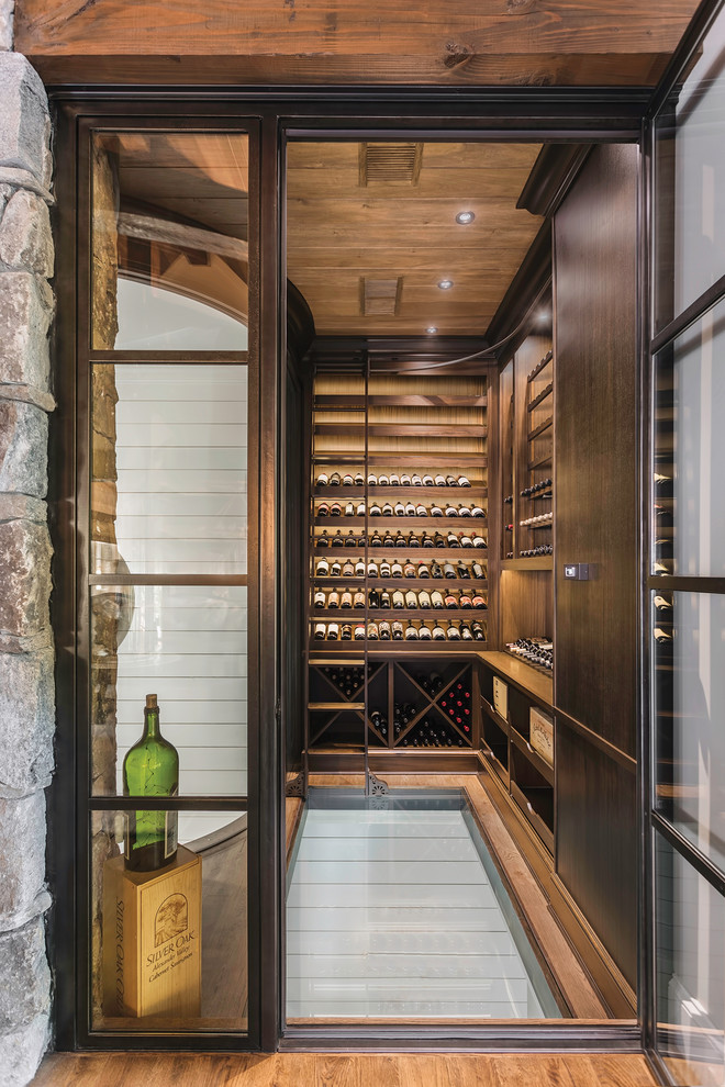 Inspiration for a large rustic wine cellar remodel in Other with display racks