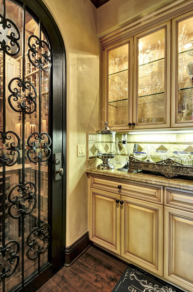 Inspiration for a mid-sized mediterranean medium tone wood floor wine cellar remodel in Los Angeles with storage racks