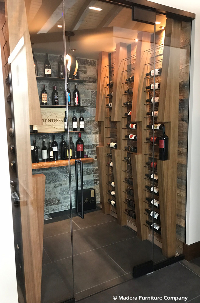 Inspiration for a large contemporary wine cellar in Seattle with porcelain flooring, display racks and grey floors.