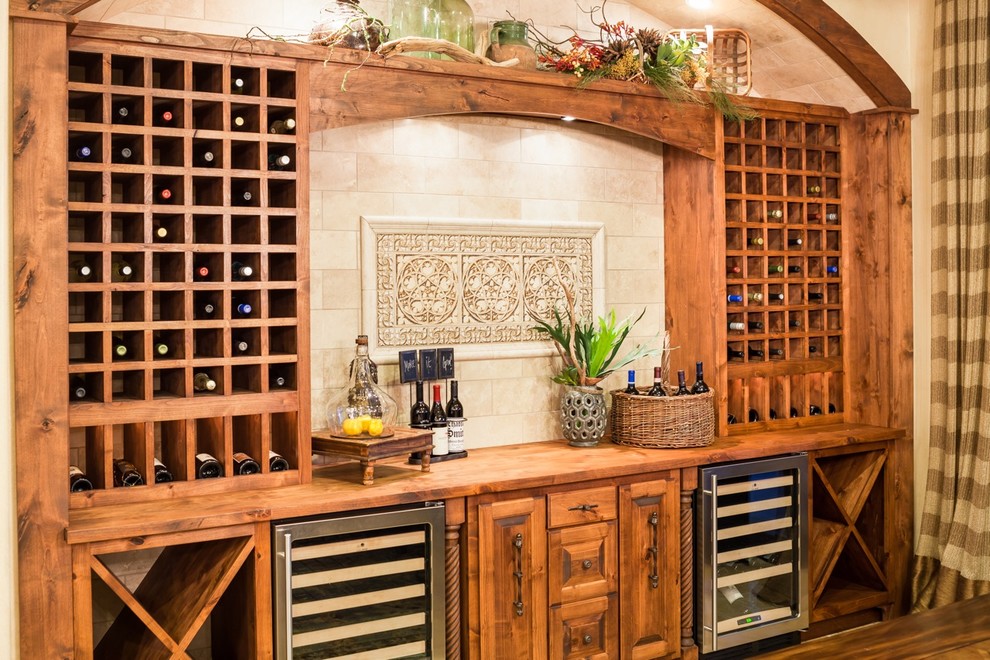 Example of a tuscan wine cellar design in Houston