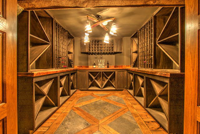 This is an example of a large traditional wine cellar in Chicago with medium hardwood flooring, cube storage and multi-coloured floors.