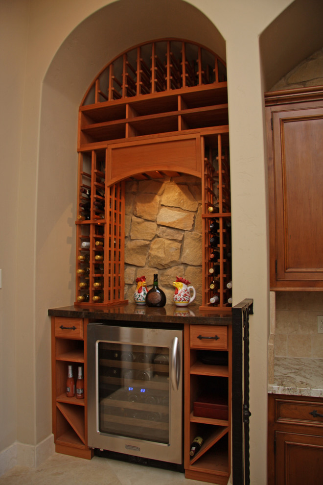 Example of a tuscan wine cellar design in Sacramento