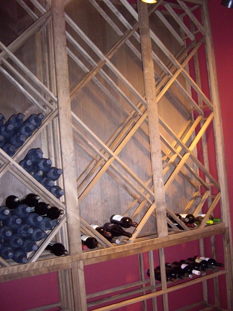 Small elegant wine cellar photo in New Orleans with storage racks