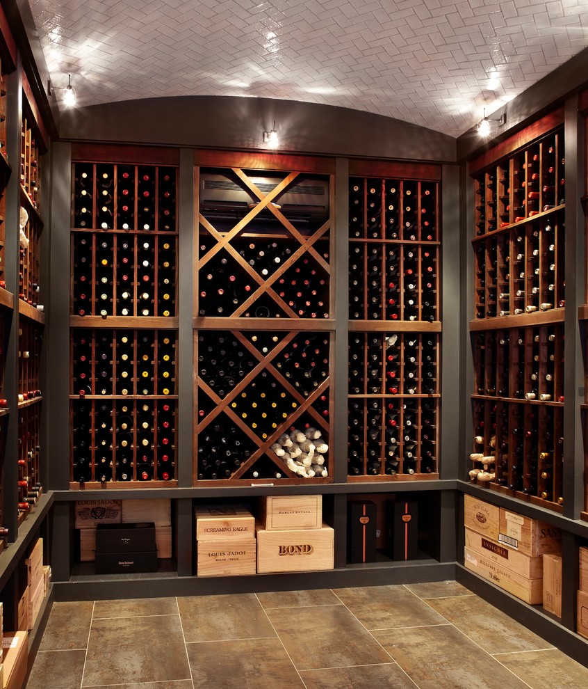 This is an example of a traditional wine cellar in Chicago with brown floors.