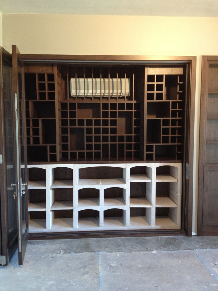 Photo of a contemporary wine cellar in Austin.
