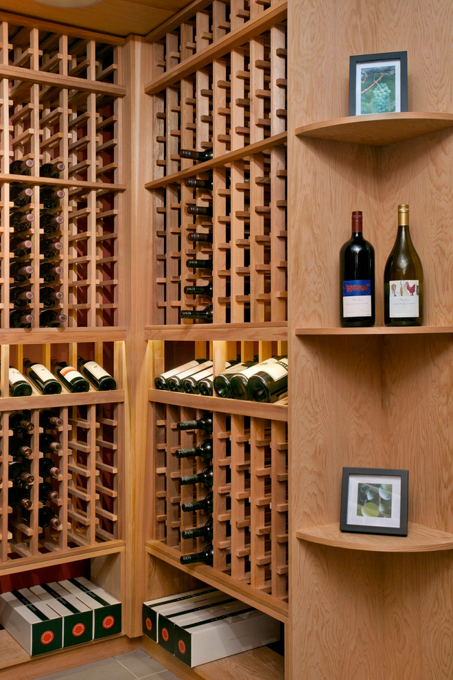 Inspiration for a large traditional wine cellar in Sydney with porcelain flooring and storage racks.