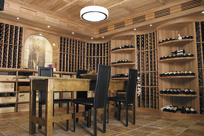 Wine cellar - large contemporary slate floor wine cellar idea in Cincinnati with display racks