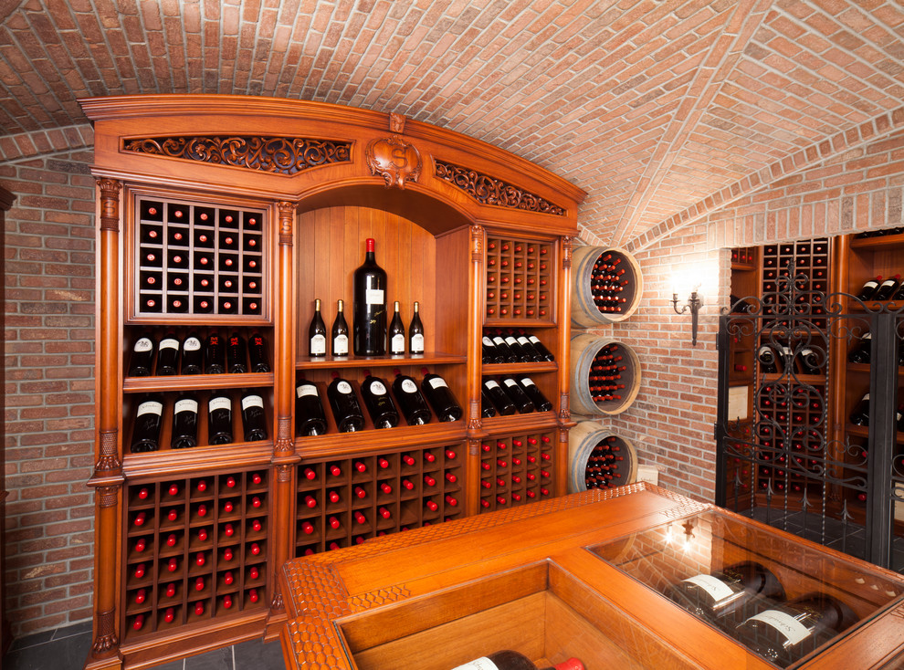Design ideas for an expansive traditional wine cellar in New York with display racks and grey floors.