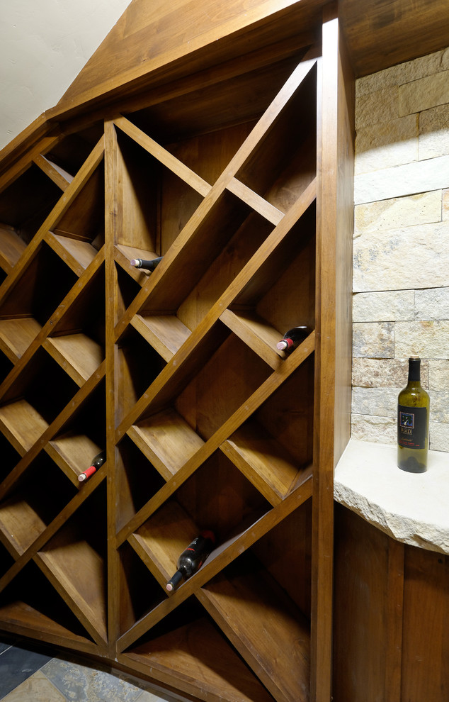 Eclectic wine cellar photo in Denver