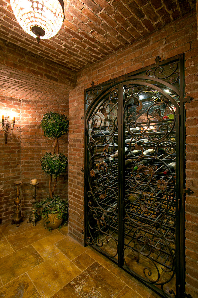 Medium sized rustic wine cellar in Cincinnati with marble flooring, storage racks and yellow floors.