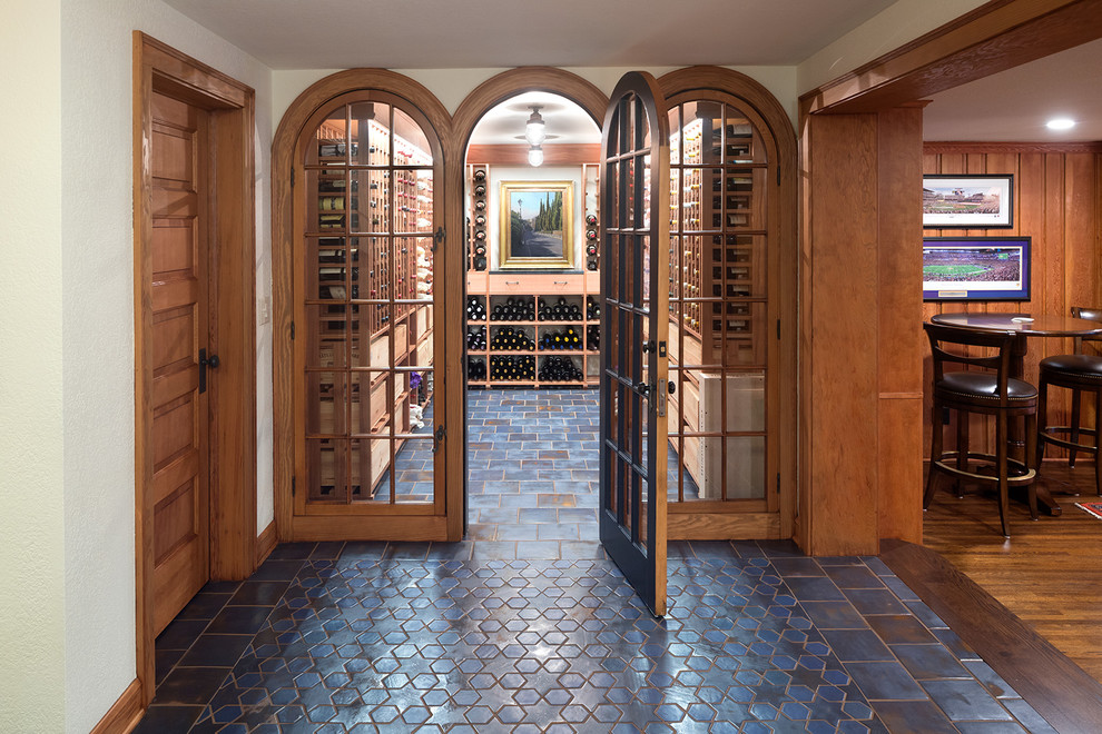 Design ideas for a traditional wine cellar in Minneapolis with storage racks and blue floors.