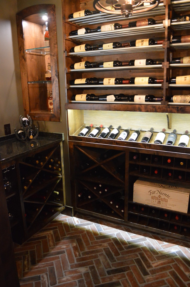 Inspiration for a small traditional wine cellar in Kansas City with brick flooring and storage racks.