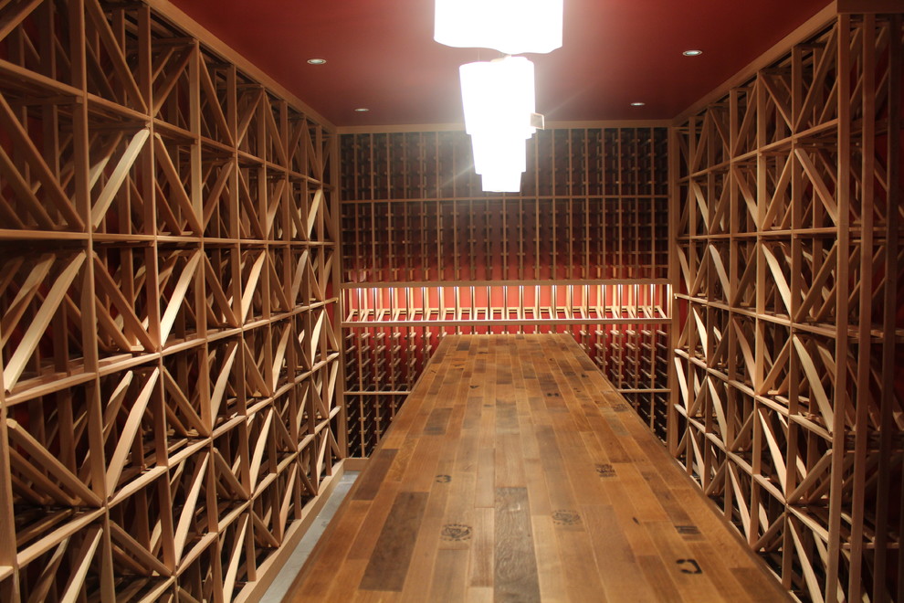 This is an example of a large classic wine cellar in Denver with slate flooring and cube storage.