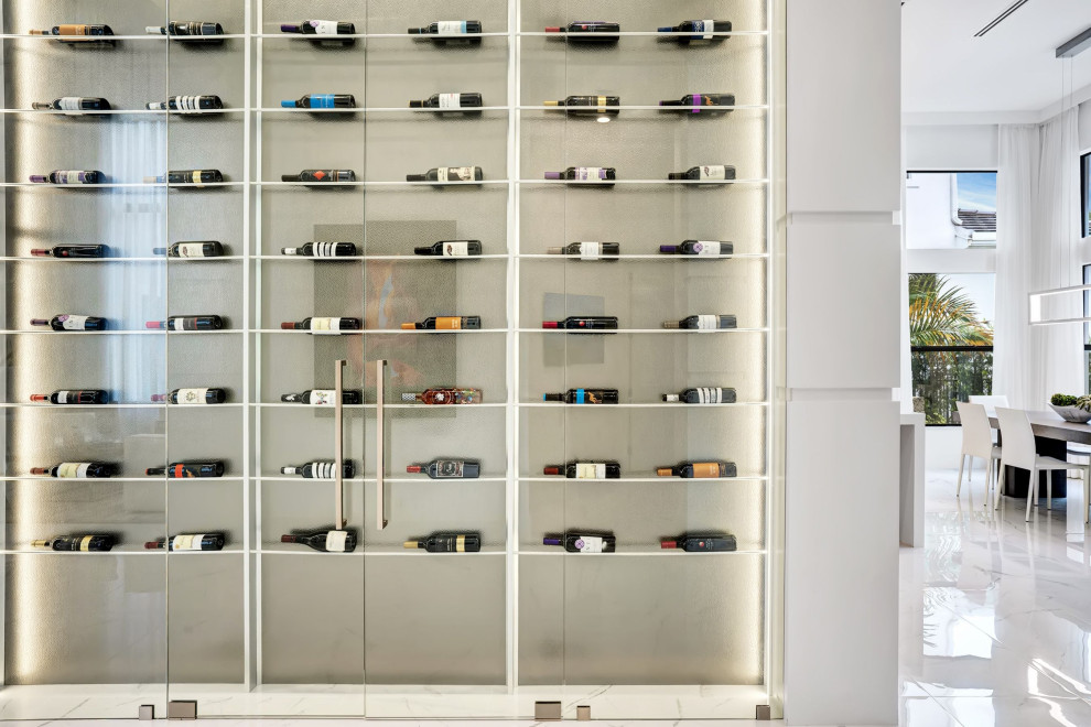 Mid-sized trendy porcelain tile and white floor wine cellar photo in Miami with display racks