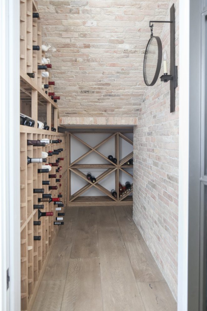 Example of a cottage wine cellar design in Orange County
