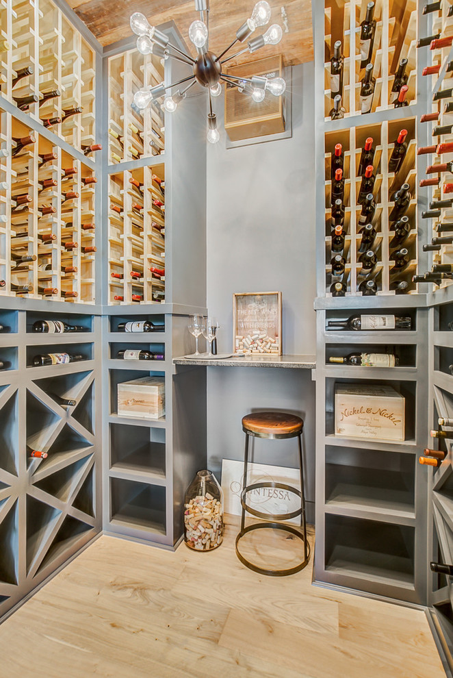 Inspiration for a country wine cellar in Dallas with light hardwood flooring, storage racks and beige floors.