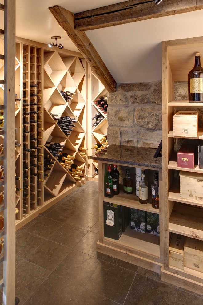 Inspiration for a transitional ceramic tile wine cellar remodel in Boise with diamond bins