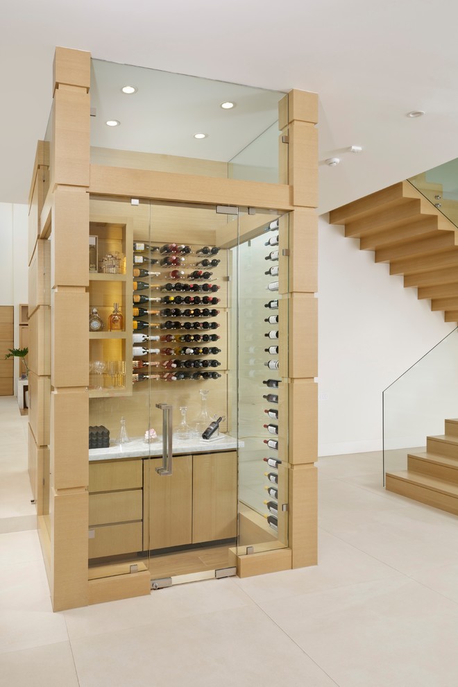 Example of a small minimalist wine cellar design in Houston with display racks