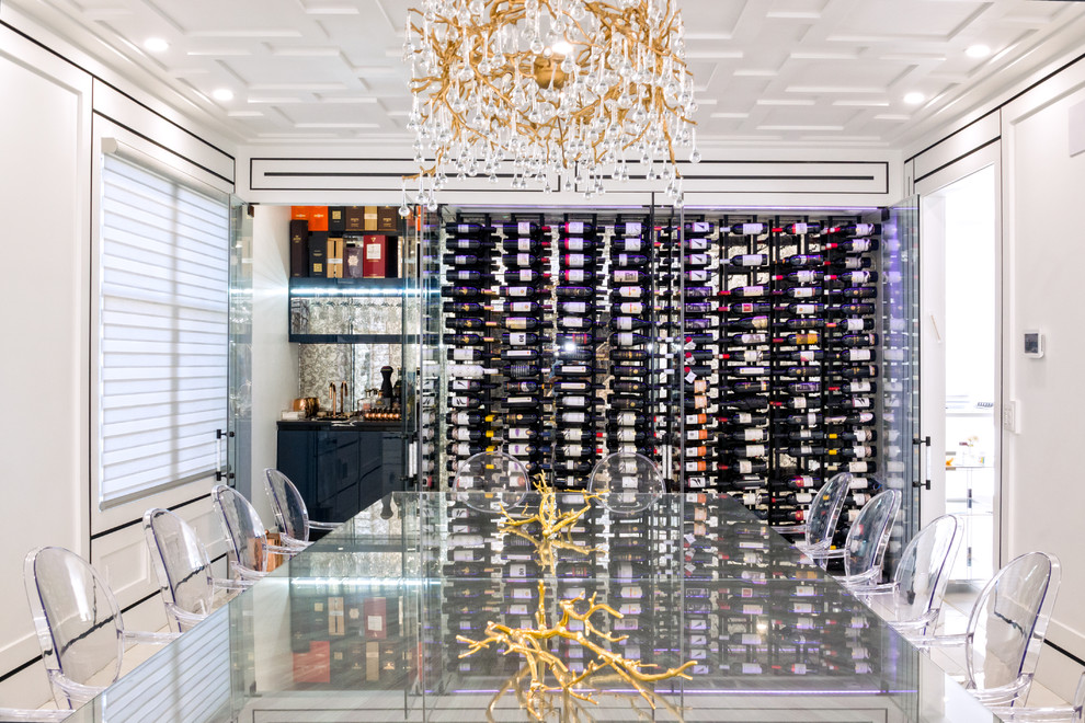 Photo of a medium sized modern wine cellar in New York with marble flooring, display racks and white floors.