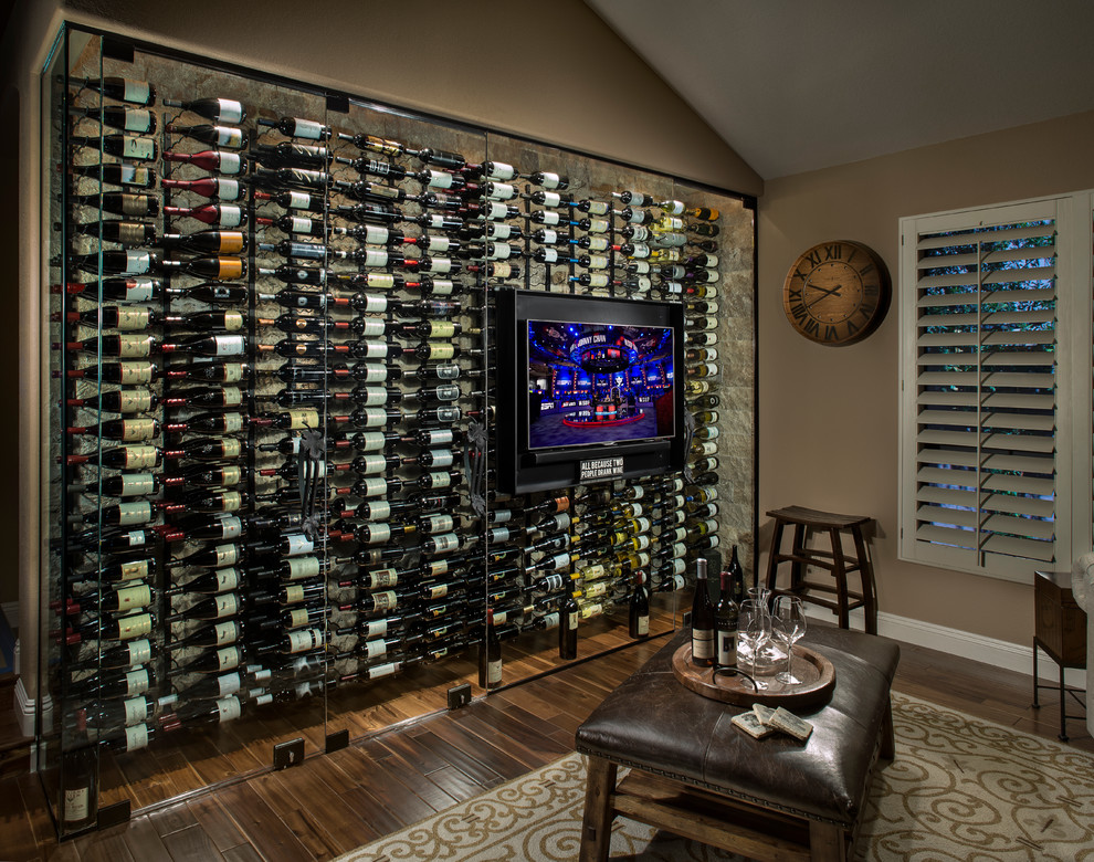 Mid-sized trendy painted wood floor and brown floor wine cellar photo in Phoenix with storage racks