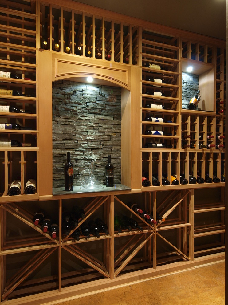 Design ideas for a large contemporary wine cellar in Calgary with storage racks.