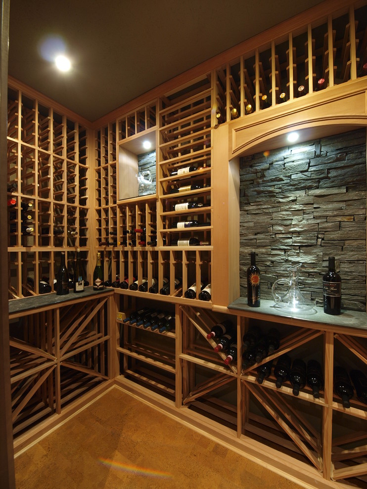 This is an example of a large contemporary wine cellar in Calgary with storage racks.