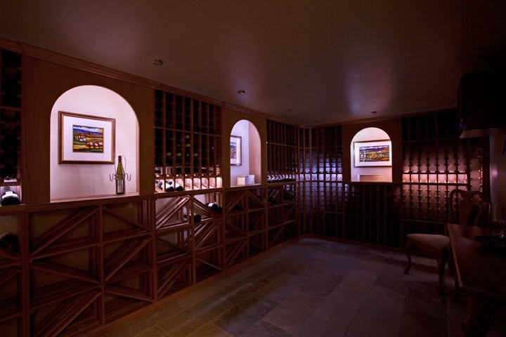 Example of a large classic slate floor wine cellar design in Vancouver with storage racks